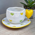 Ceramic mug with heart shaped handle