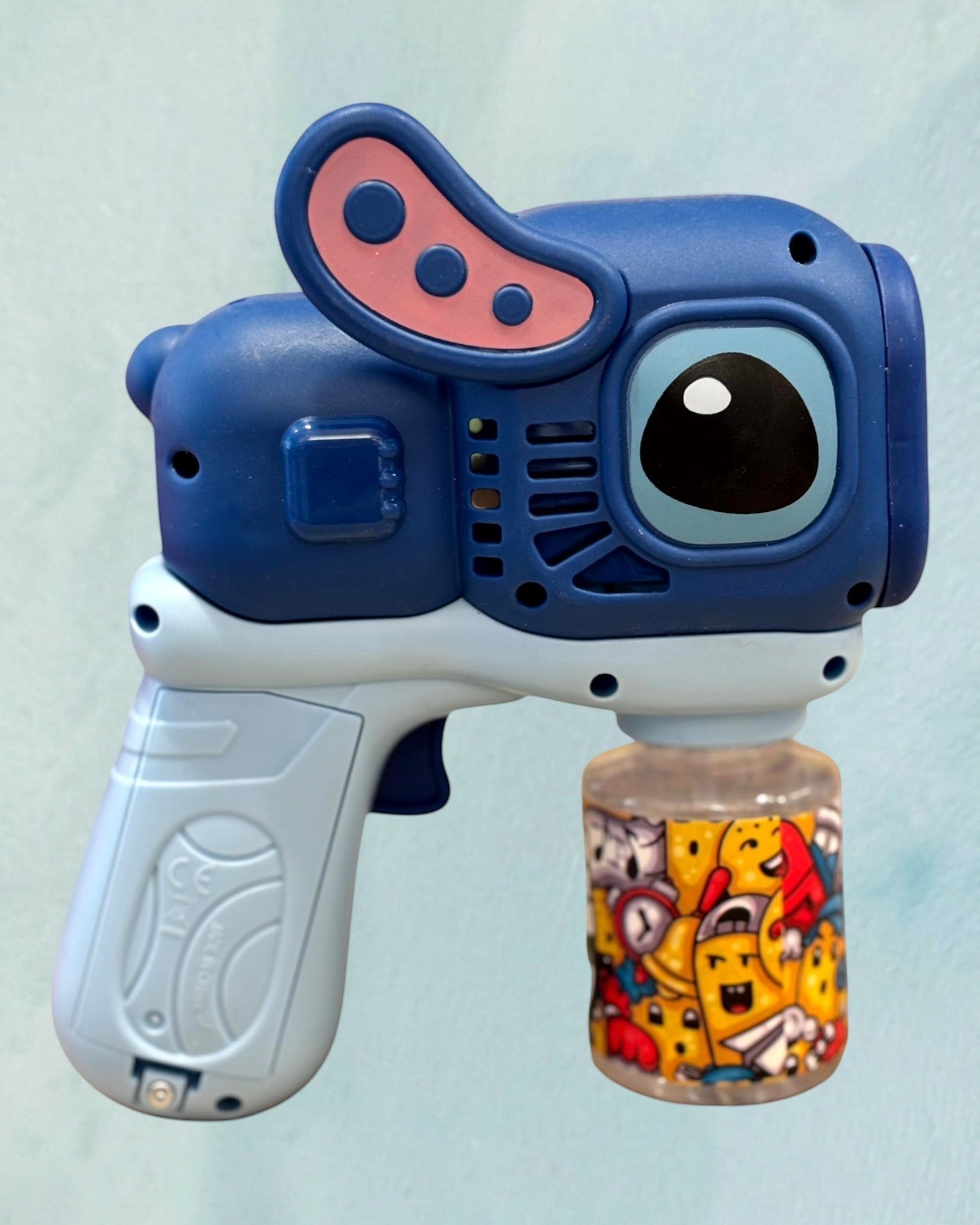 Tagerelsa3ada blue automatic bubble gun toy with a cartoon character design and a colorful bubble solution bottle.