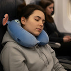 Tagerelsa3ada blue plush character neck pillow with orange ears and a wide smile, perfect for travel comfort.