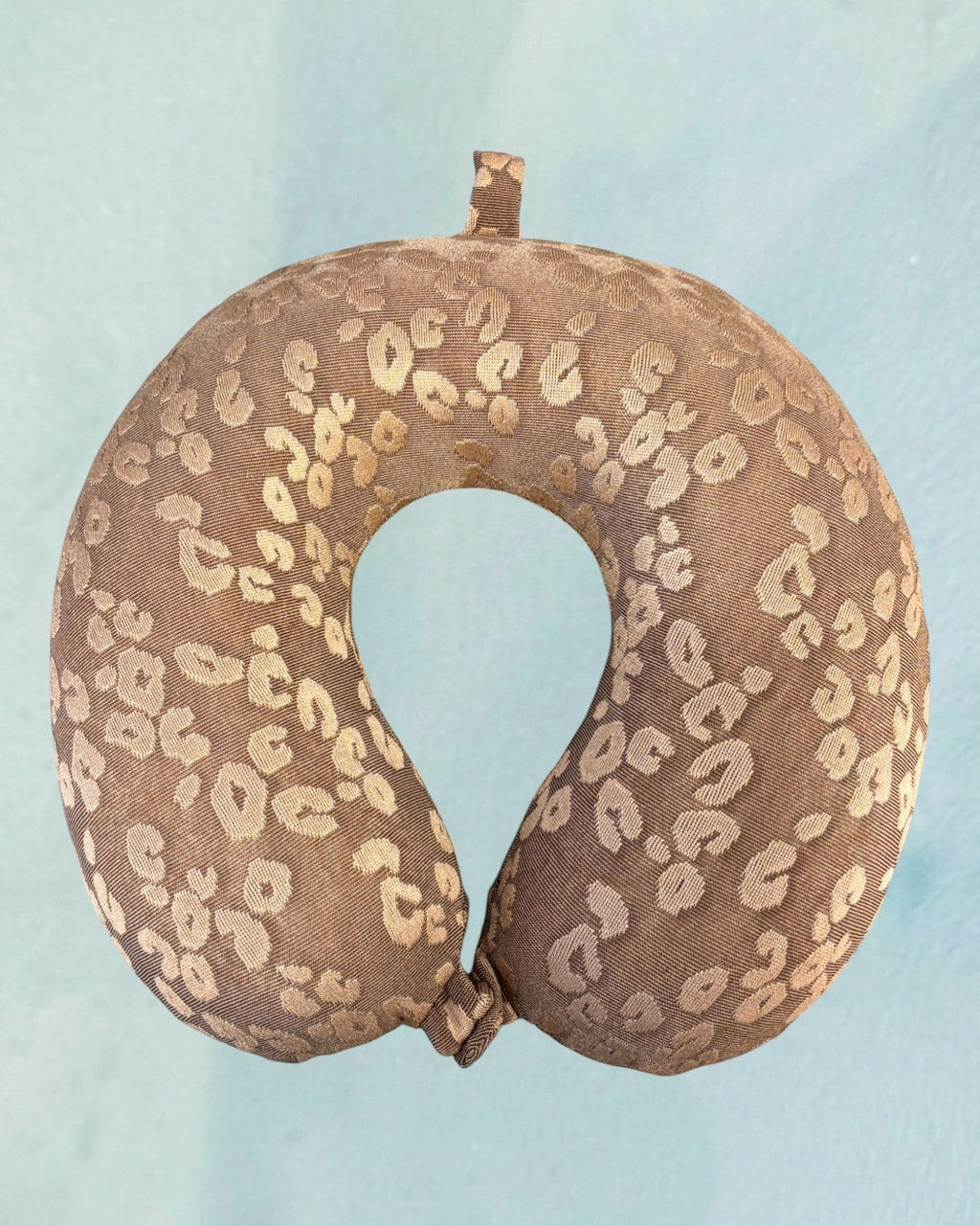 Tagerelsa3ada brown leopard print travel neck pillow with loop for hanging.