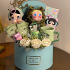 Tagerelsa3ada blue gift box with cartoon characters, snow globe, mug, and cream roses.