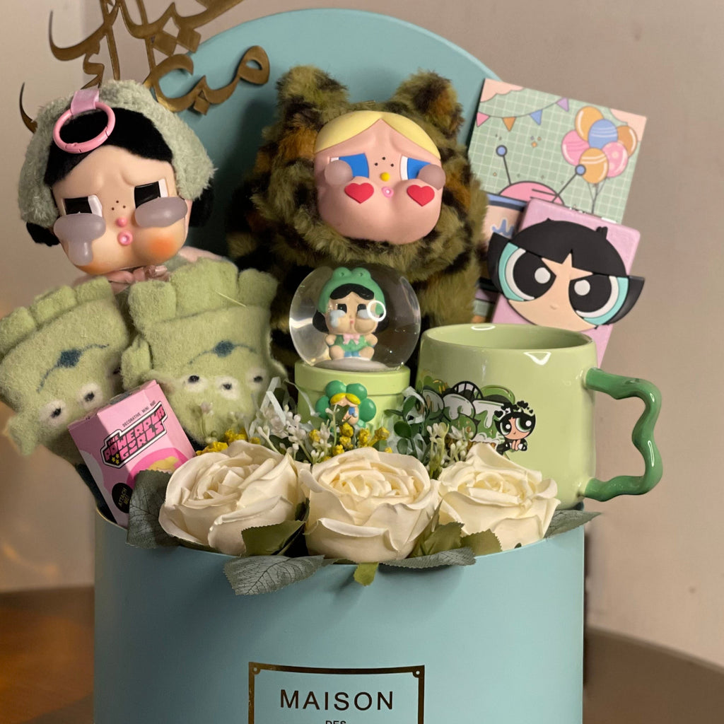 Tagerelsa3ada cartoon character gift box with dolls, snow globe, mug, and cream roses in a blue box.
