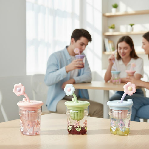 Tagerelsa3ada colourful flower tumbler with straw, available in pink, green, and blue.