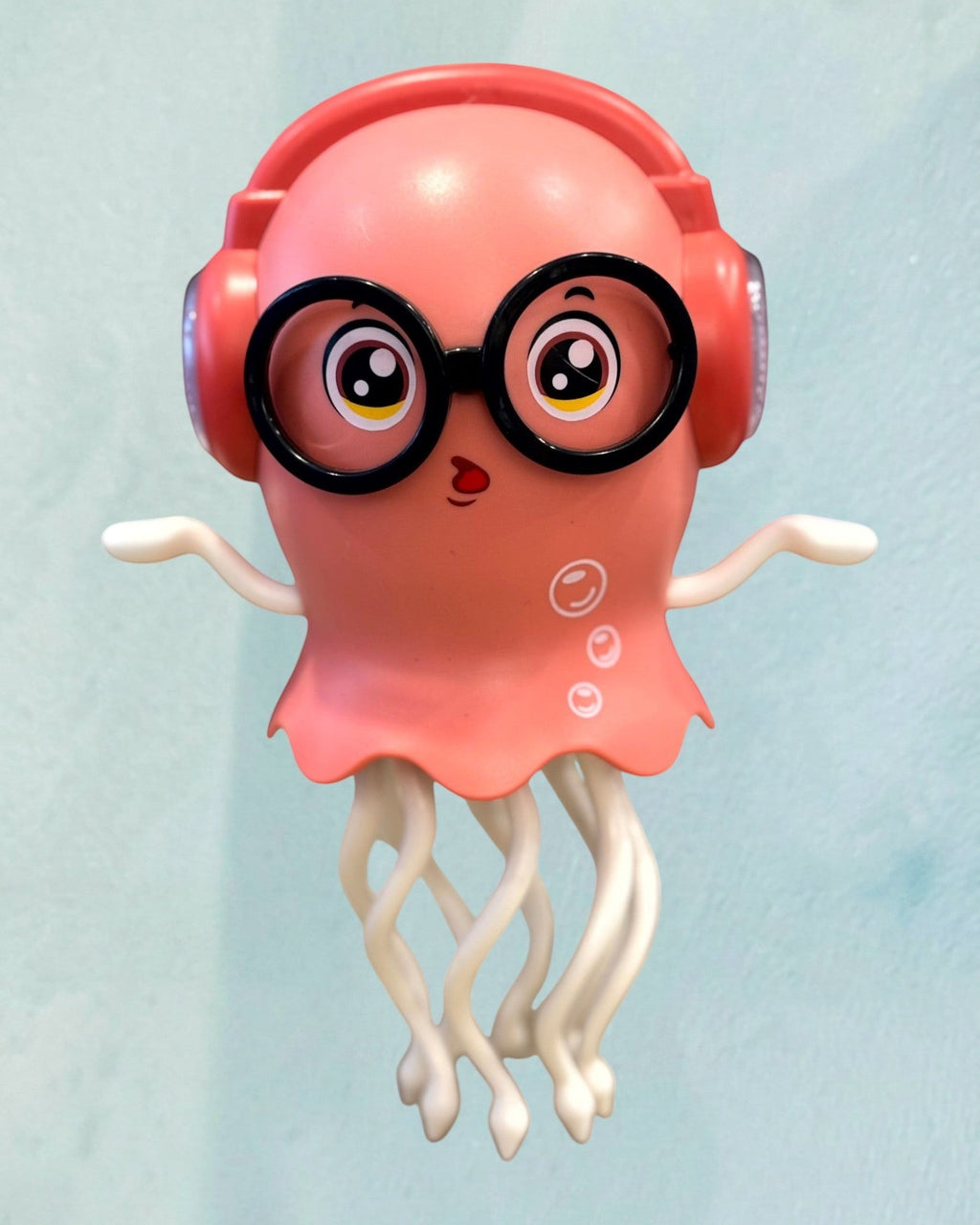 Tagerelsa3ada pink dancing jellyfish toy with headphones and glasses, singing and moving.