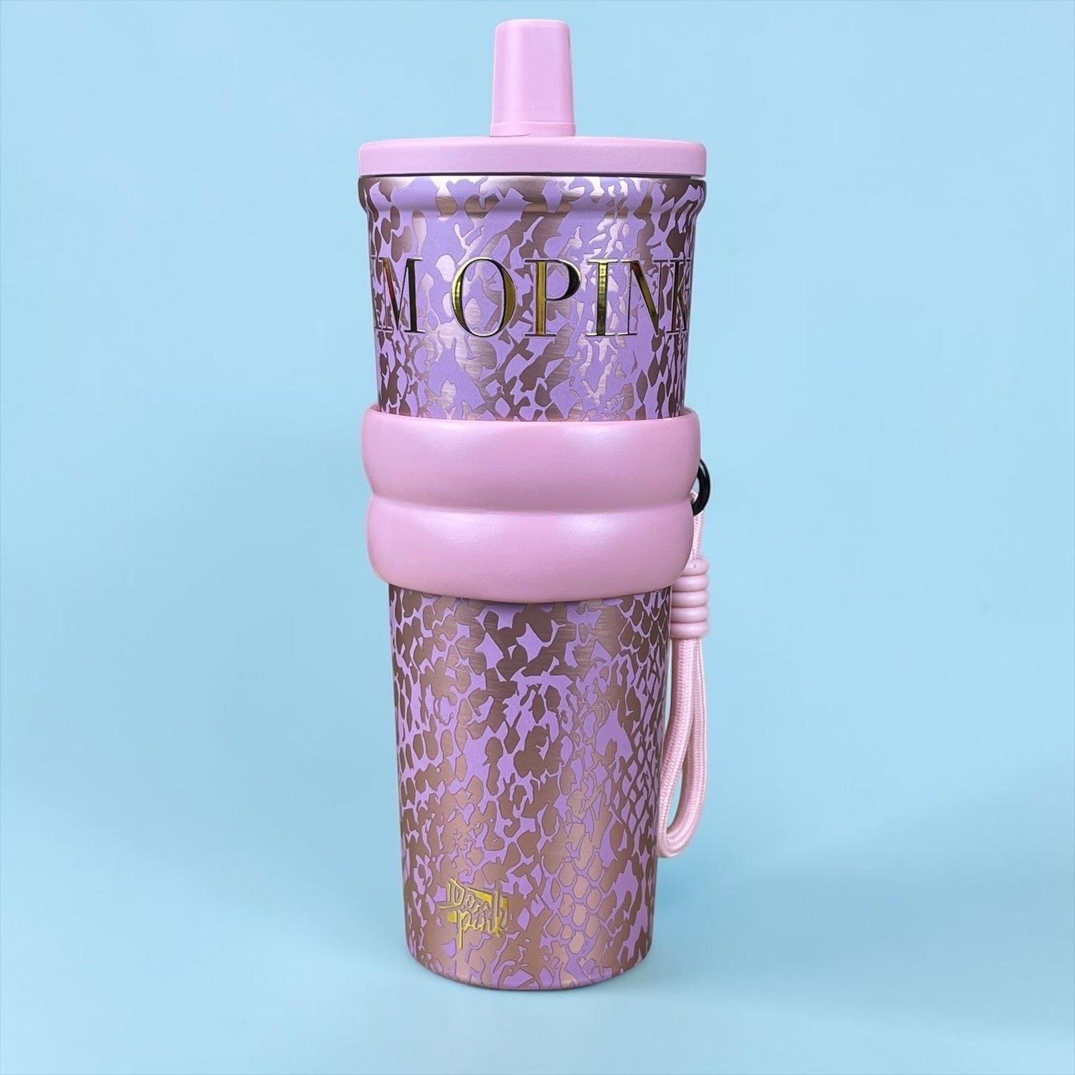 Tagerelsa3ada designer tumbler with strap, lilac with snakeskin pattern and gold lettering, pink strap and lid.