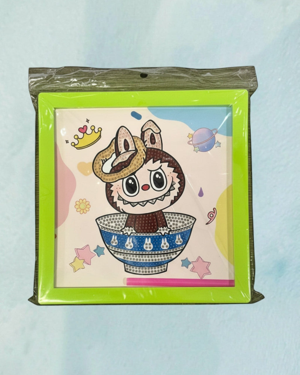 Tagerelsa3ada diamond painting kit with frame featuring a cartoon character in a bowl with planets and stars. Includes frame and tools.