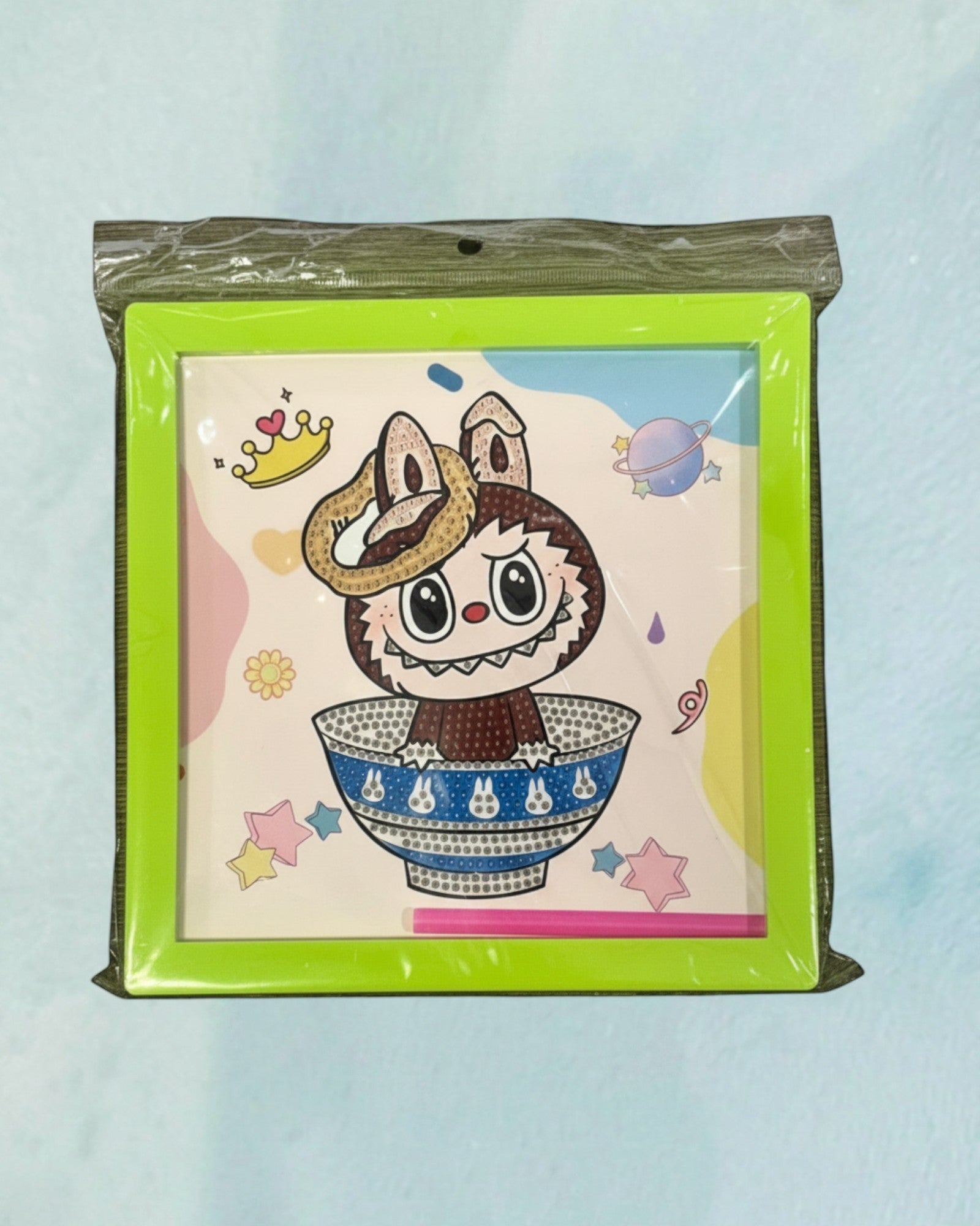 Tagerelsa3ada diamond painting kit with frame featuring a cartoon character in a bowl with planets and stars. Includes frame and tools.