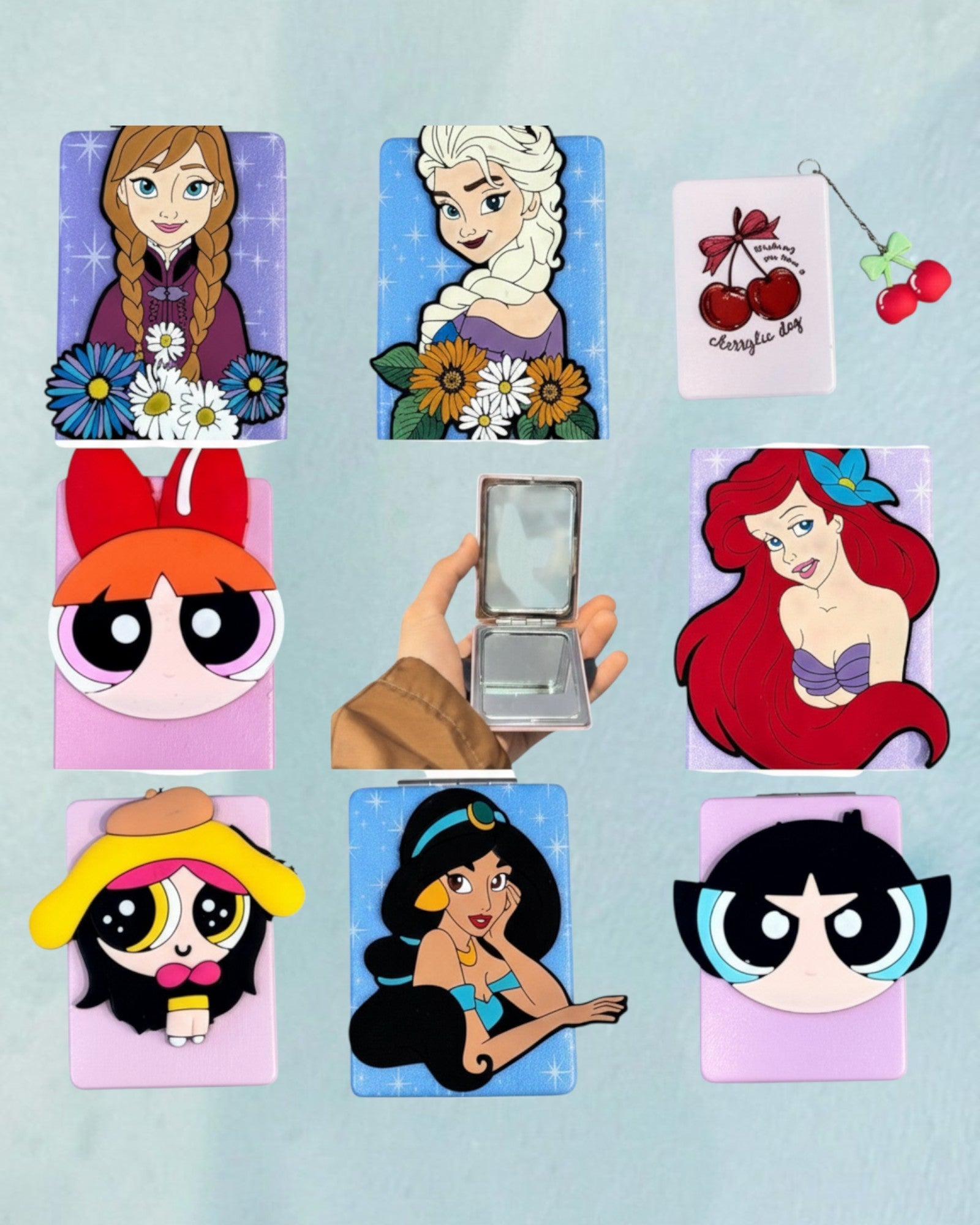 Tagerelsa3ada Disney Princess compact mirror with decorative charm, featuring Anna, Elsa, Ariel, Jasmine, and Powerpuff Girls designs.