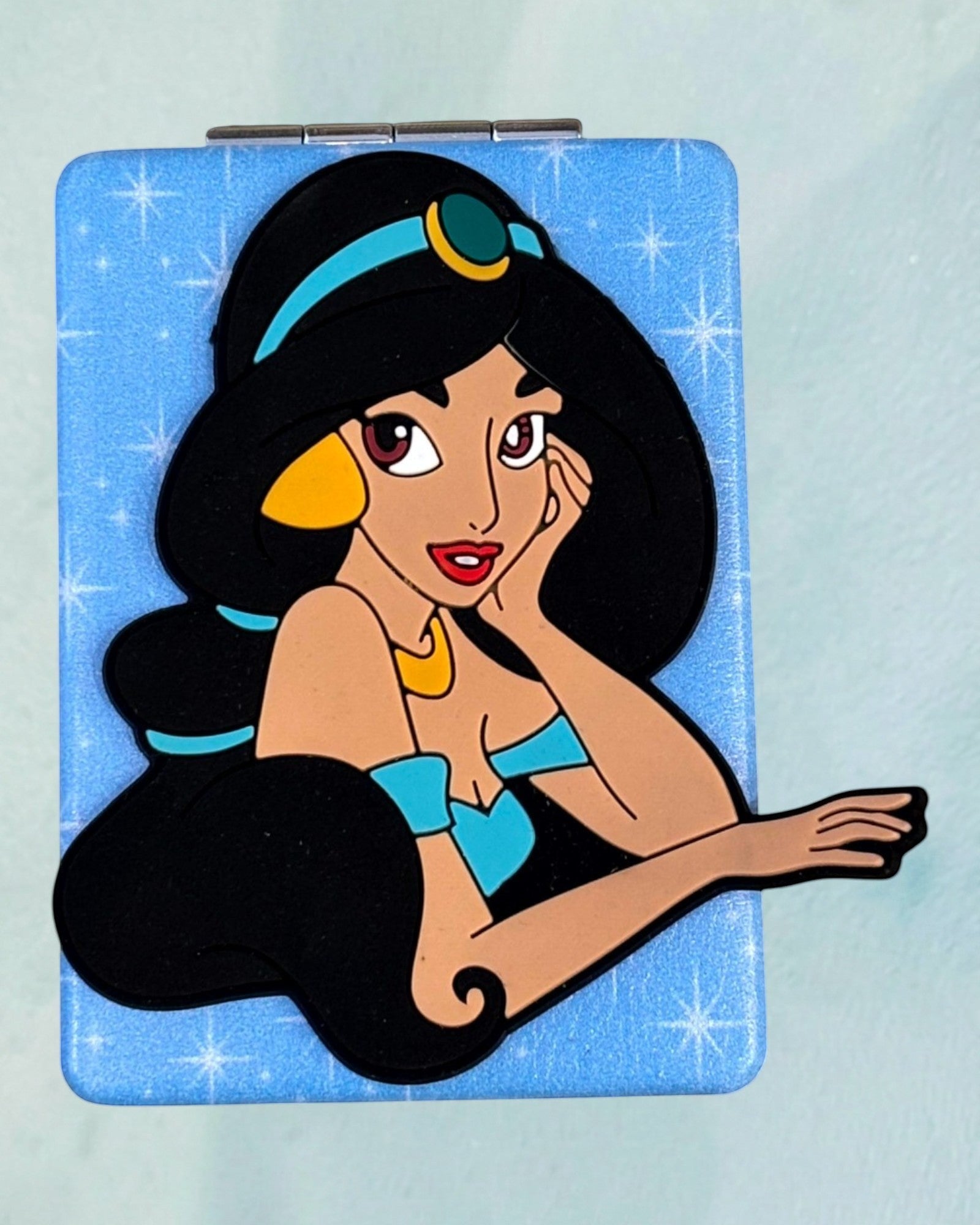 Tagerelsa3ada Disney Princess Jasmine compact mirror with blue sparkle background.