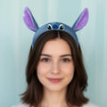 Tagerelsa3ada Disney Stitch plush headband with large purple-lined ears and embroidered facial features.