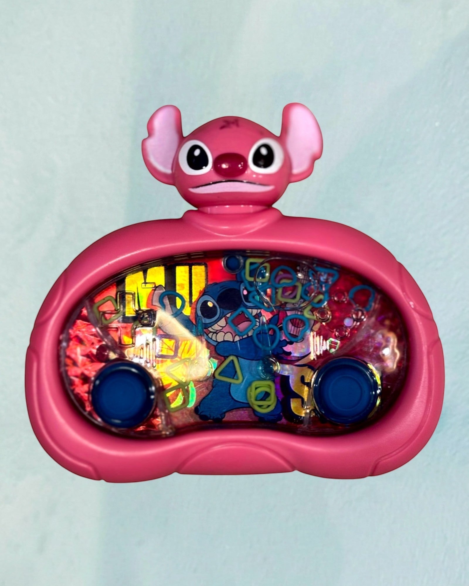 Tagerelsa3ada pink Disney Stitch water game with blue buttons and floating rings. Features Stitch characters on a water-filled screen.