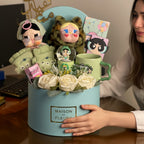Tagerelsa3ada gift box with plush toys, ceramic mug, snow globe, and artificial roses.