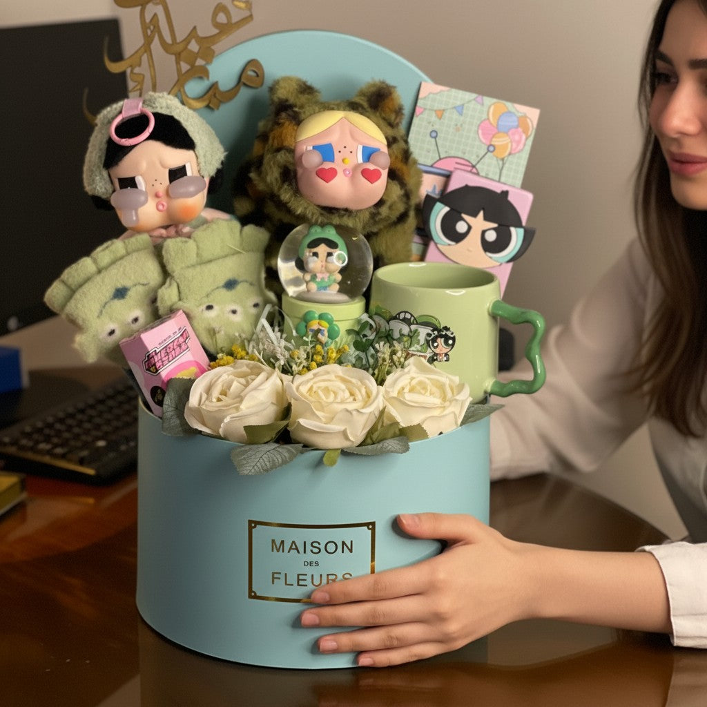Tagerelsa3ada gift box with plush toys, ceramic mug, snow globe, and artificial roses.