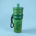 Tagerelsa3ada green snakeskin tumbler with gold lettering and black strap. Durable design with secure lid.