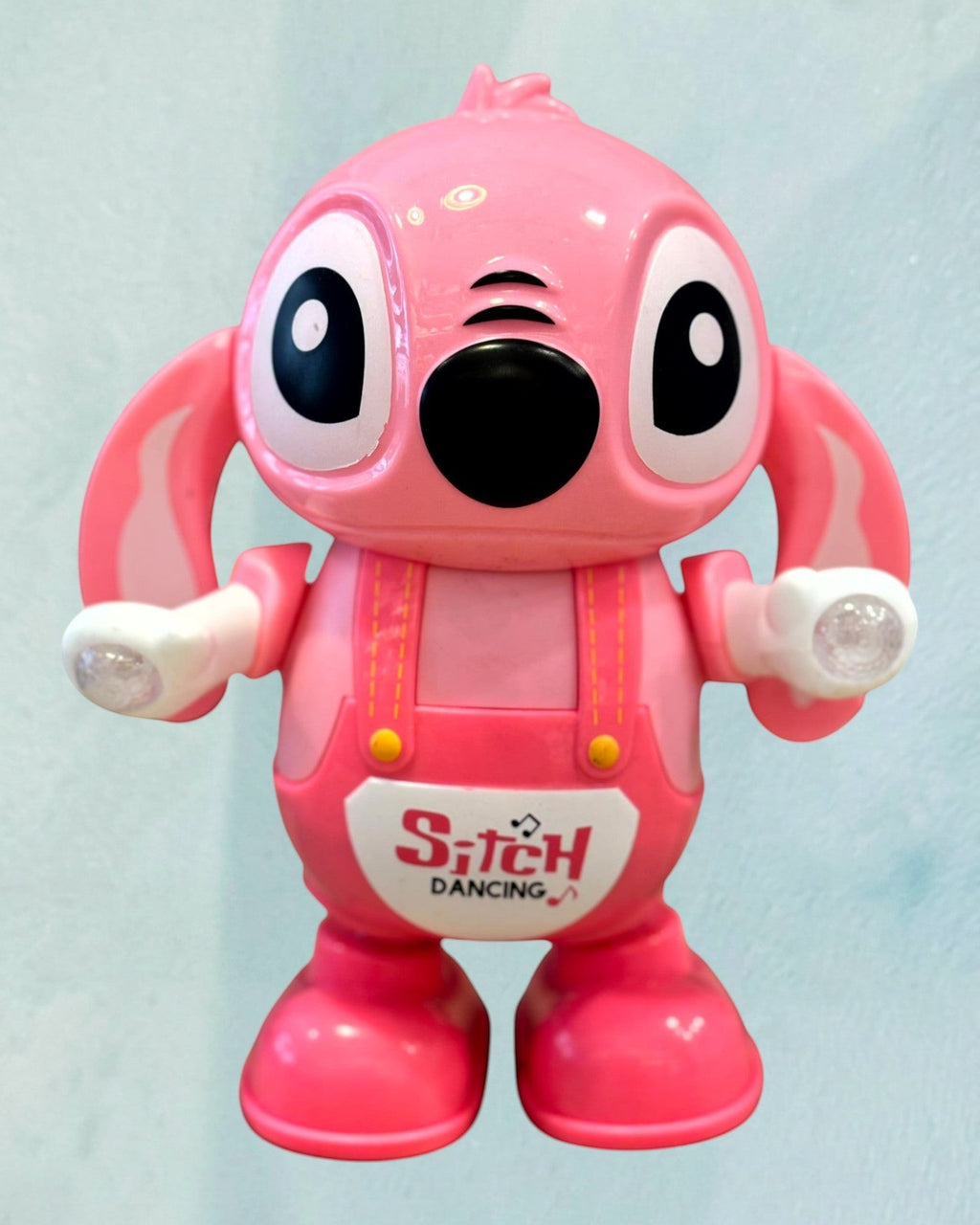 Tagerelsa3ada pink dancing character toy with flashing lights and sound