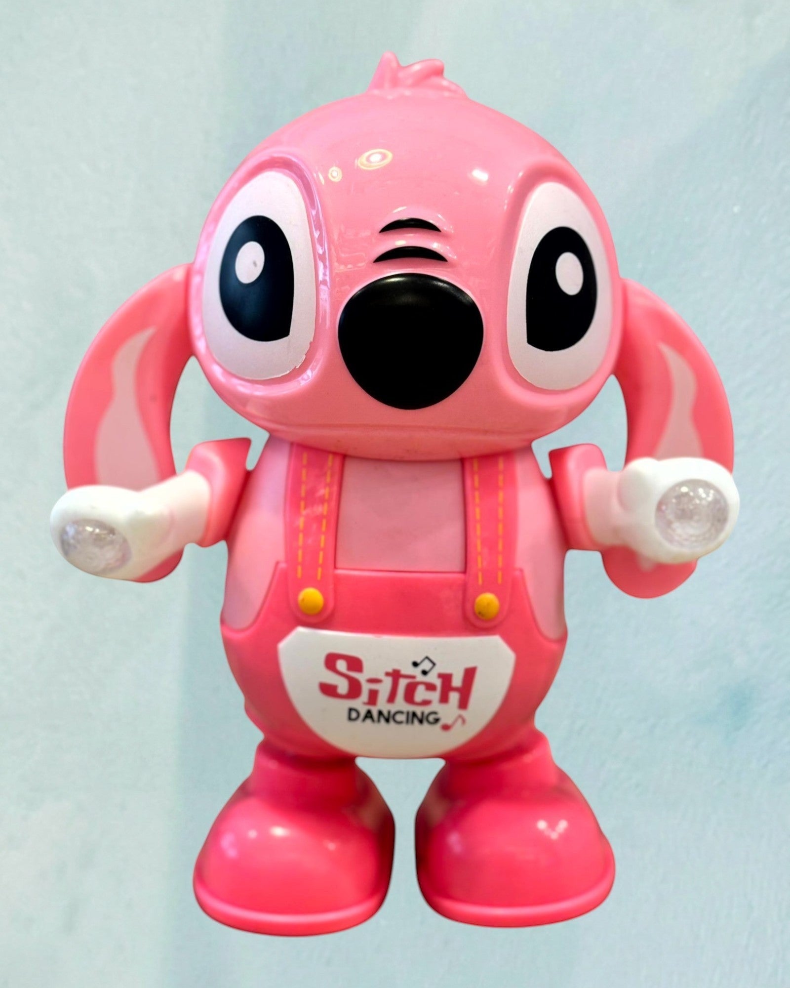 Tagerelsa3ada pink dancing character toy with flashing lights and sound