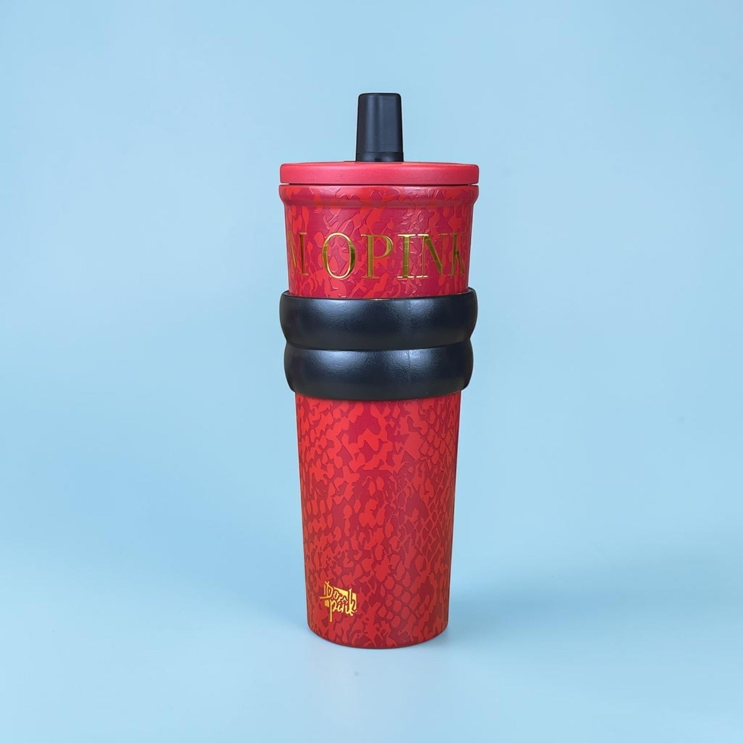 Tagerelsa3ada red snakeskin tumbler with gold lettering and black strap, includes lid and straw.