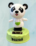 Tagerelsa3ada solar powered dancing panda figurine wearing a white shirt and green apron, swaying on a lime green base.